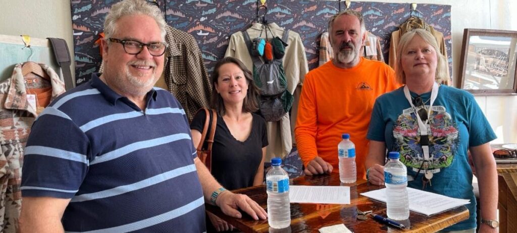 group of 4 people smiling